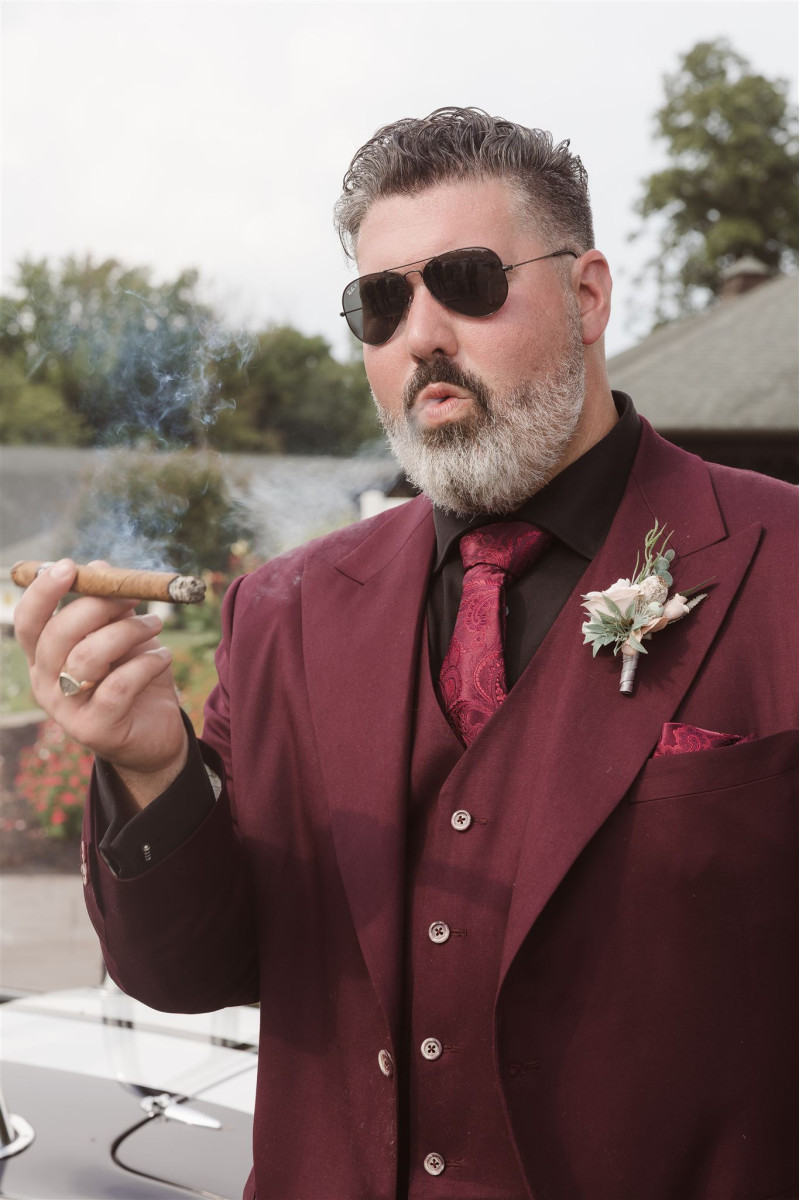 Groom boutonniere in blush pink, white, and beige with elegant neutral floral accents