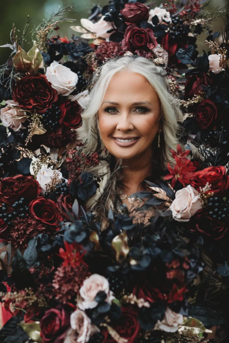 Moody bridal bouquet in burgundy, beige, black, and gold with silk flowers