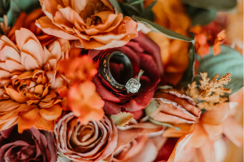 Faux wedding bouquet in rich autumn shades of burgundy, dusty rose, and terracotta
