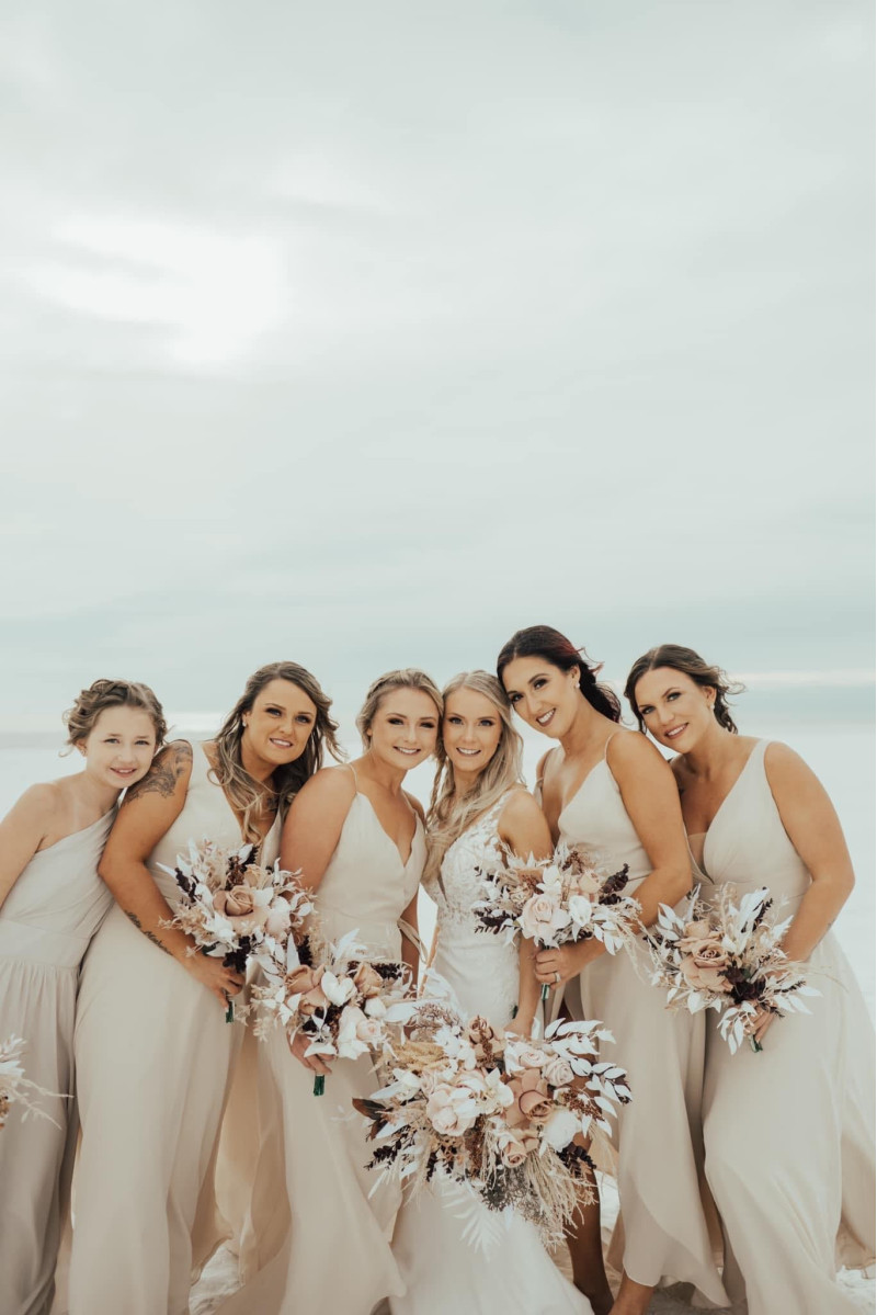 Boho bridal bouquet in beige, white, and brown with pampas grass and textured blooms