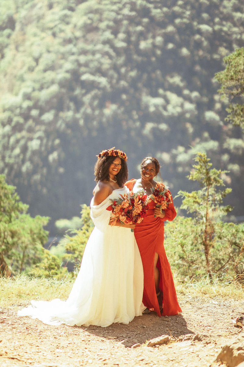 Coordinated wedding florals in rust burgundy cinnamon orange theme