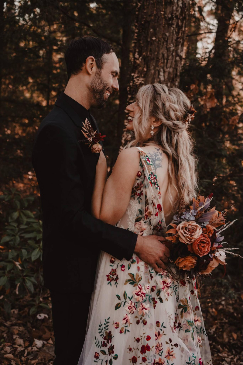Burgundy and terracotta bridal bouquet with rich autumn tones and textured florals
