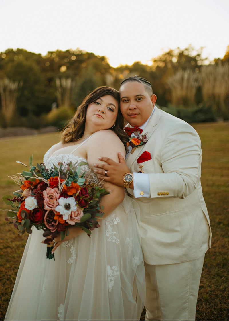 Bridal bouquet in burgundy, rust, ivory, and cinnamon with rich autumn floral textures