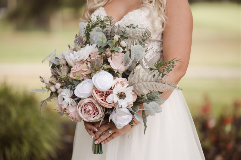 Bridal bouquet in blush pink, white, and beige with soft romantic silk flowers