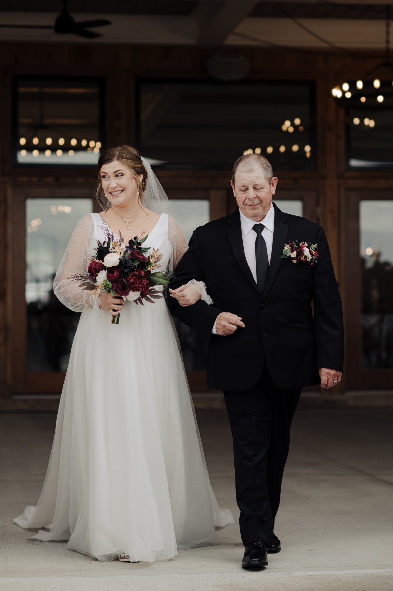 Wedding bouquet in burgundy and ivory with black flower details