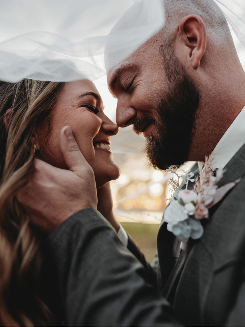Wedding floral details in blush pink and beige with bridal bouquet and groom boutonniere