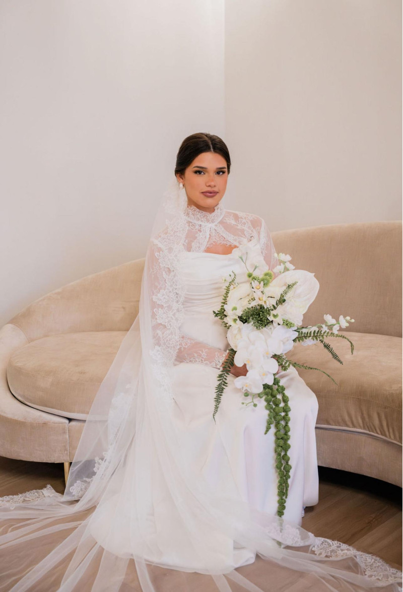 Bride with White & Green Cascading Orchid Wedding Bouquet and Lace Veil