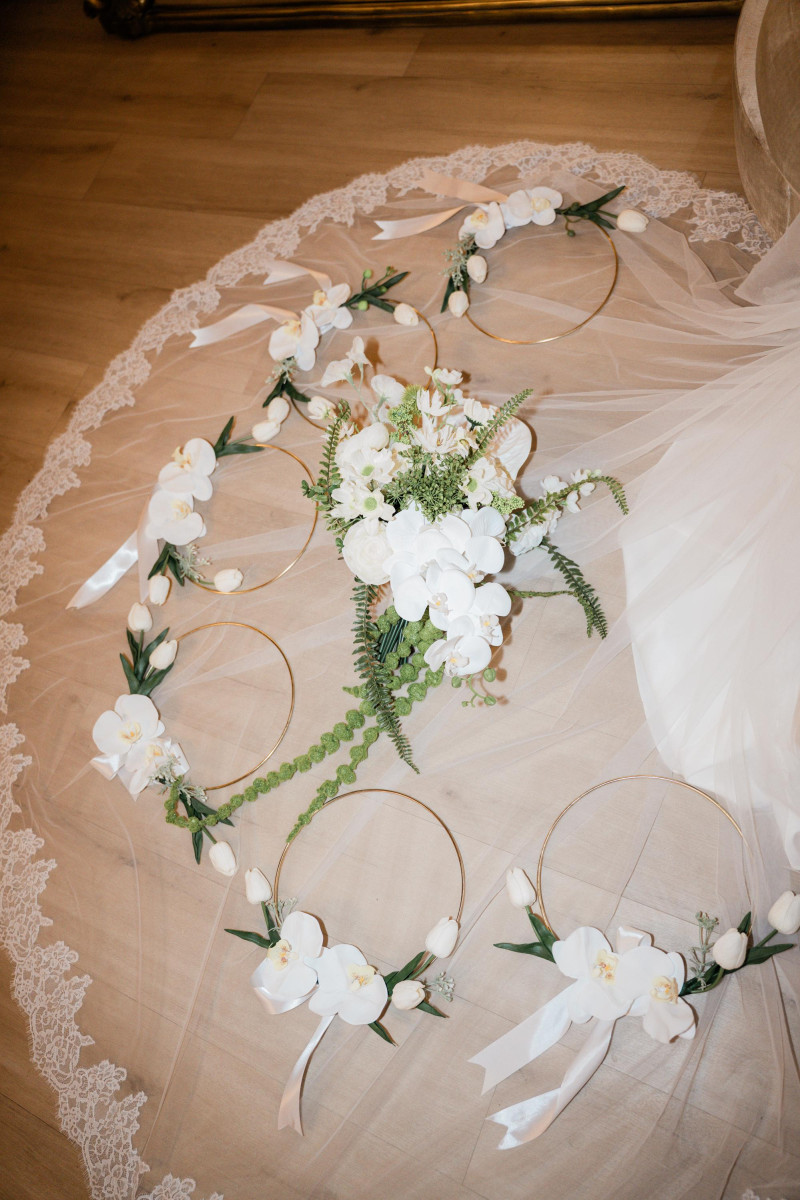 White & Green Orchid Bridal Bouquet with Matching Floral Hoops on Lace Wedding Veil