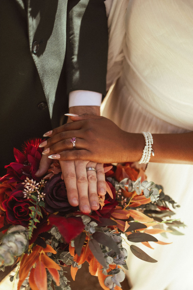 Bridal bouquet in rust, burgundy, and cinnamon orange hues