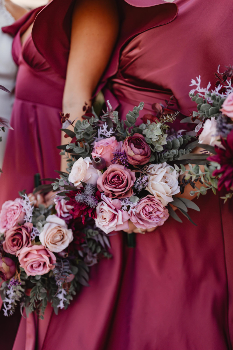 Mauve and beige bridal bouquet with purple roses and dusty greenery