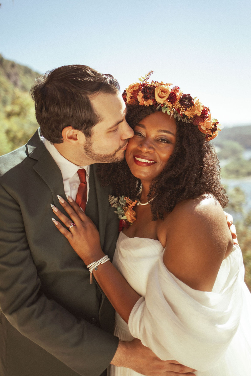 Boho-style floral hair wreath in rust and cinnamon wedding colors