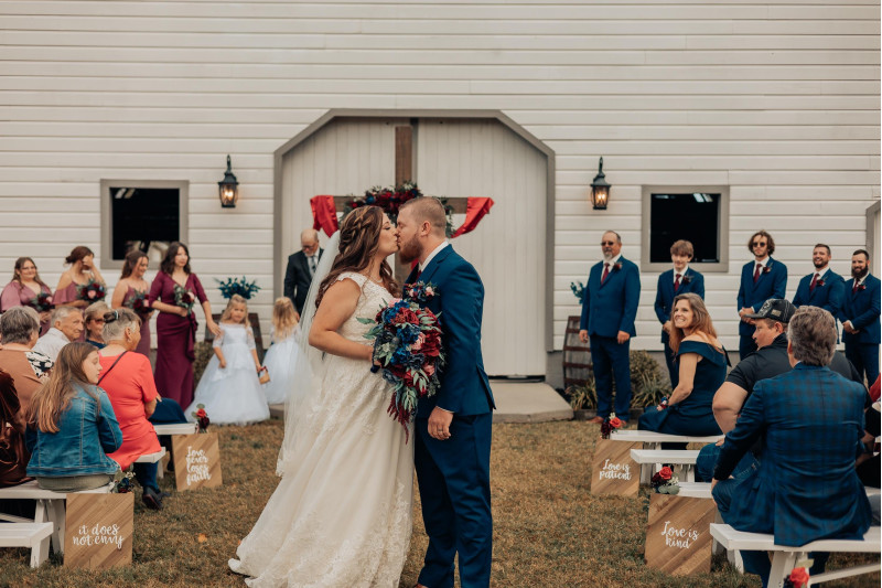 Navy blue, pink and burgundy wedding bouquet with greenery