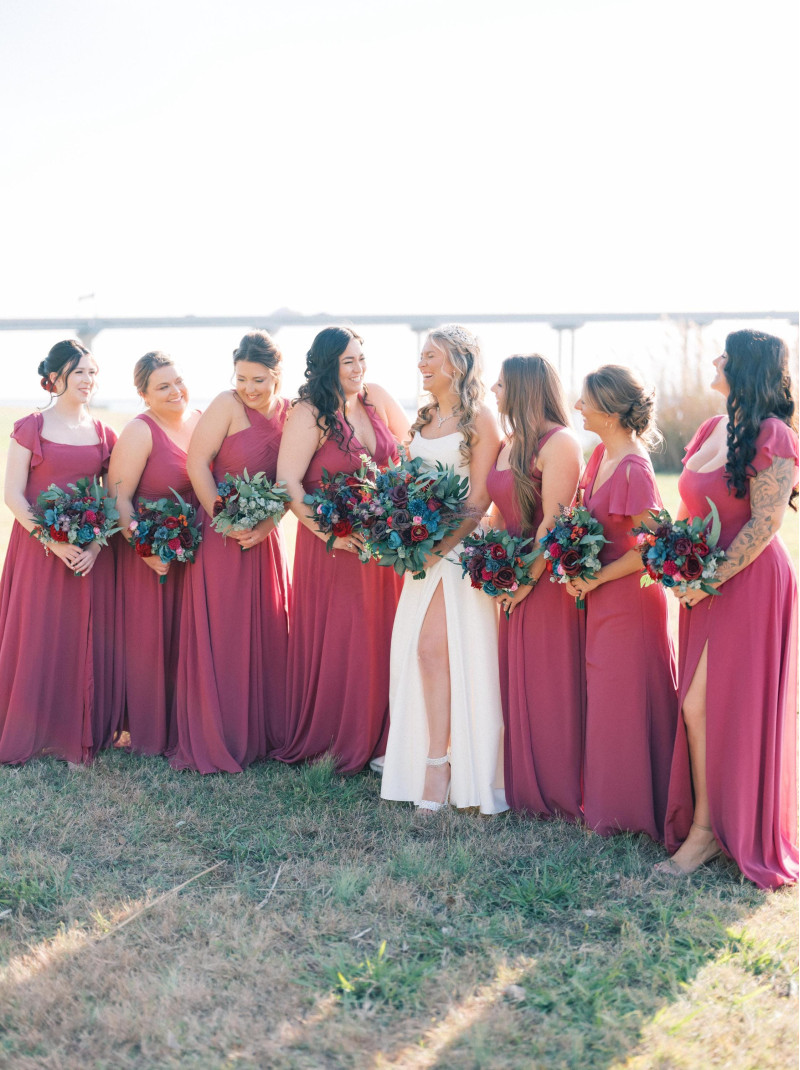 Coordinated jewel-tone bouquets for bridesmaids in rich vibrant colors