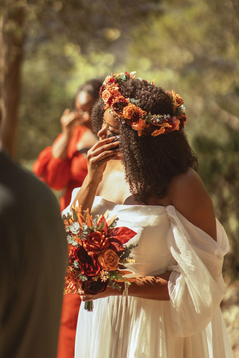 Artificial wedding flowers in rust and burgundy for intimate ceremony
