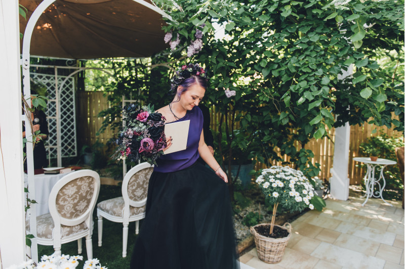 Black, purple, and magenta bridal bouquet with faux flowers for a Halloween or gothic wedding