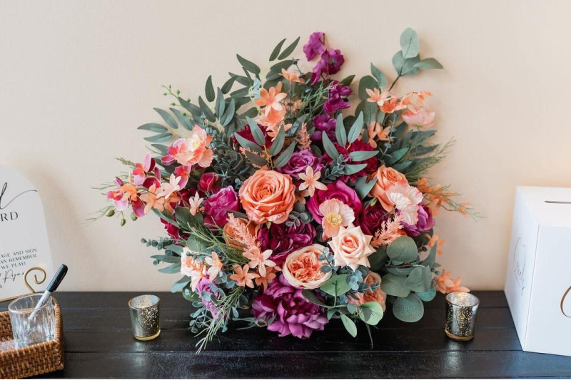 Magenta peach and coral faux floral standing aisle arrangement for wedding ceremony