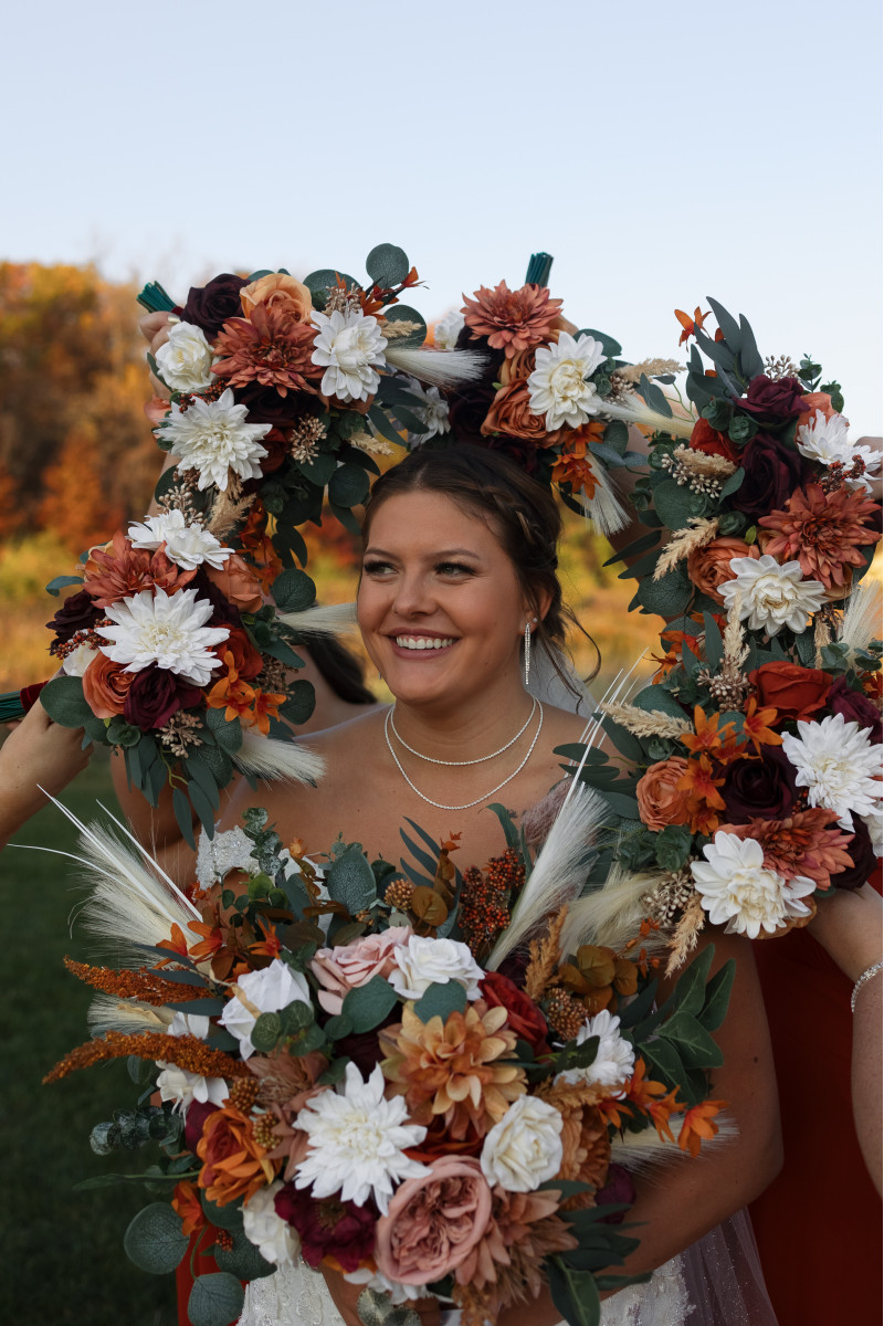 Boho wedding bouquet with pampas grass, cinnamon roses, ivory dahlias, and burgundy accents
