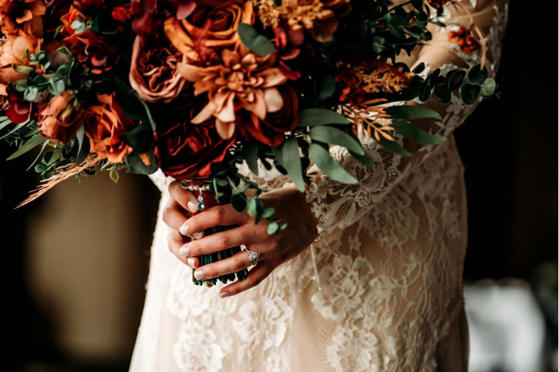 aux wedding bouquet featuring burgundy, dusty rose, terracotta, and rust flowers