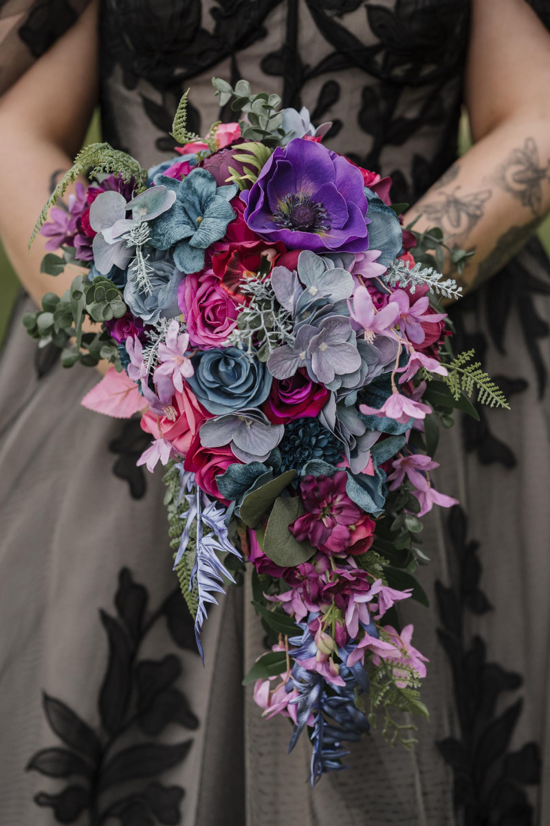 Jewel tone bridal bouquet with purple and magenta flowers
