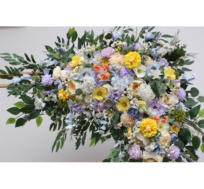 Wildflower arch flowers in yellow, ivory, dusty blue and lavender