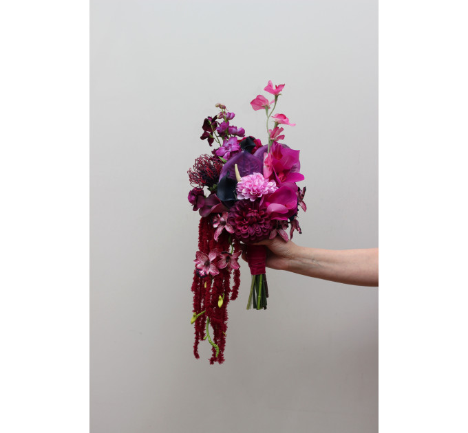 Statement asymmetrical wedding bouquet with jewel tone flowers