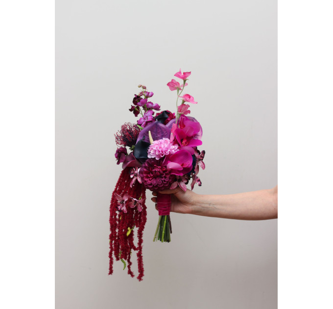 Statement asymmetrical wedding bouquet with jewel tone flowers
