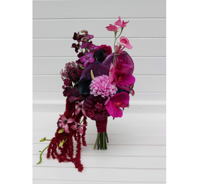 Statement asymmetrical wedding bouquet with jewel tone flowers