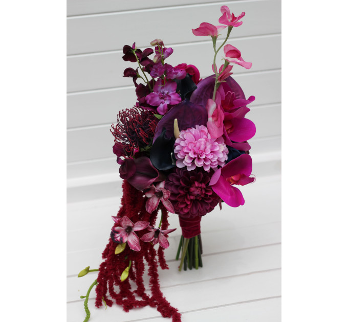 Statement asymmetrical wedding bouquet with jewel tone flowers