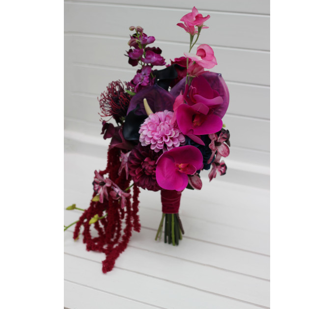 Statement asymmetrical wedding bouquet with jewel tone flowers