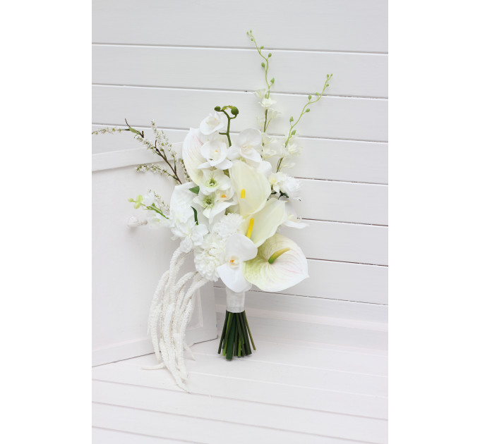 Asymmetrical bridal bouquet in white and ivory with amaranth