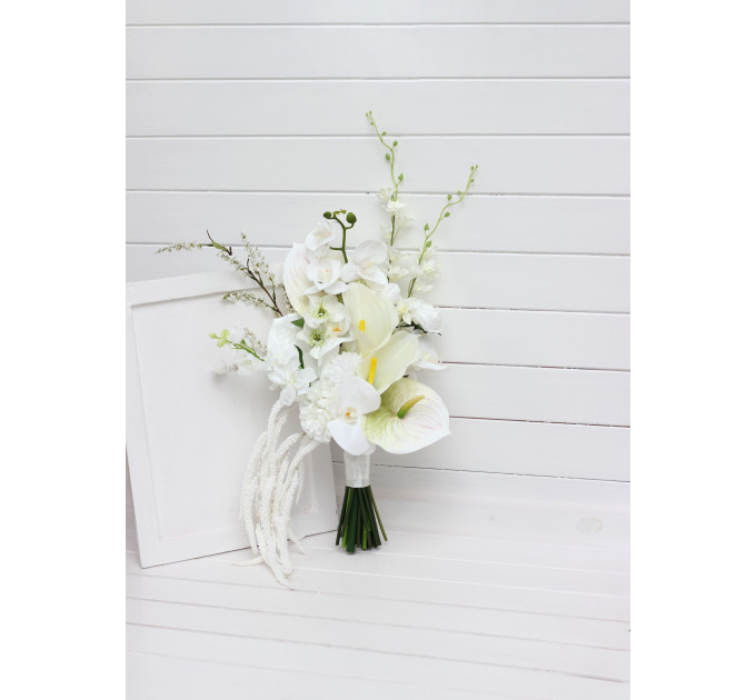 Asymmetrical bridal bouquet in white and ivory with amaranth