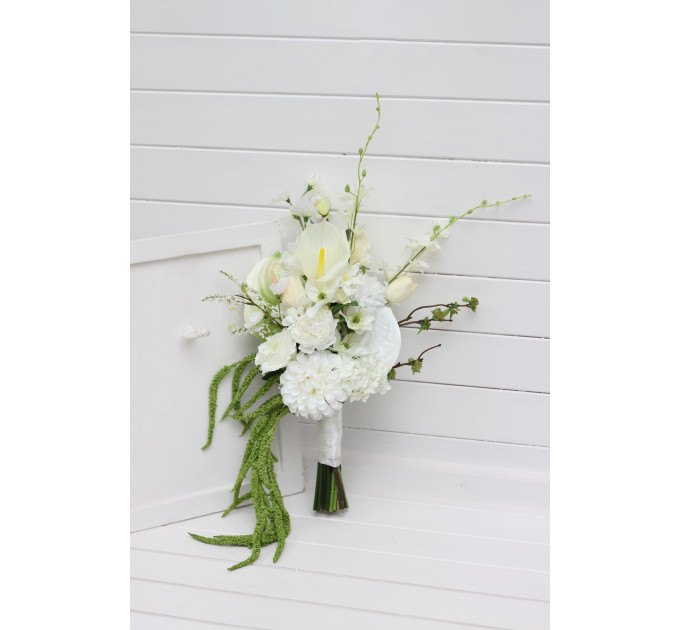 Modern asymmetrical bridal bouquet in white with cascading amaranth