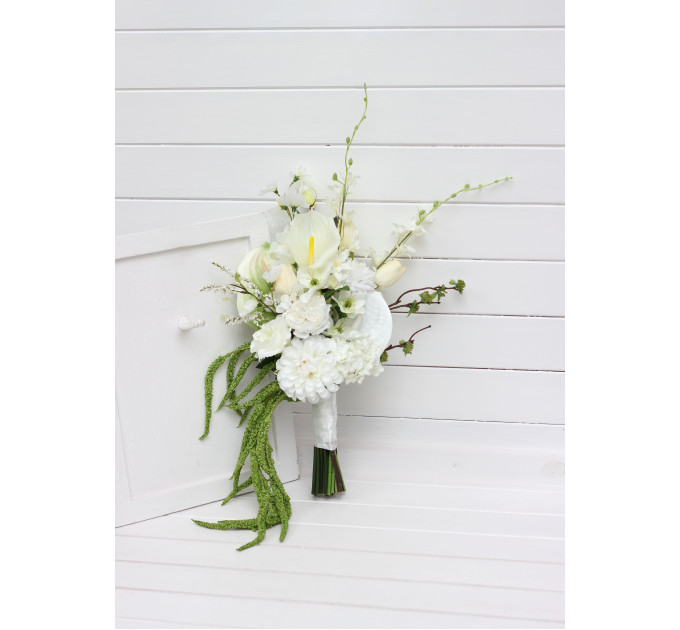 Modern asymmetrical bridal bouquet in white with cascading amaranth