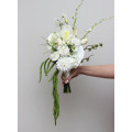 Modern asymmetrical bridal bouquet in white with cascading amaranth