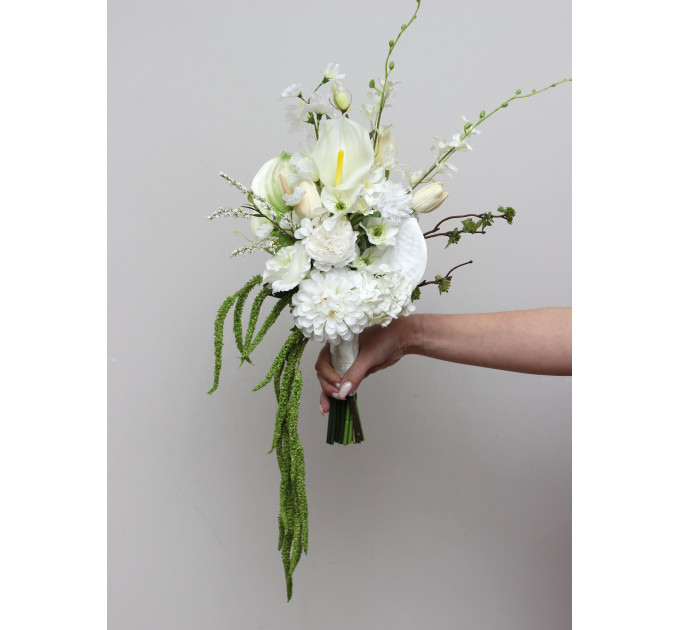 Modern asymmetrical bridal bouquet in white with cascading amaranth