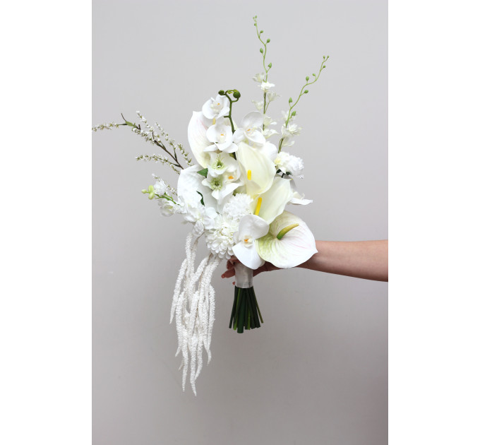 Asymmetrical bridal bouquet in white and ivory with amaranth