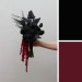 Asymmetrical black wedding bouquet with burgundy amaranth