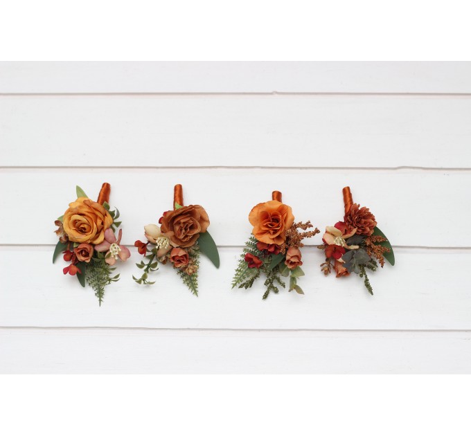 Wedding boutonnieres and wrist corsage in rust orange color scheme. Flower accessories. 5213