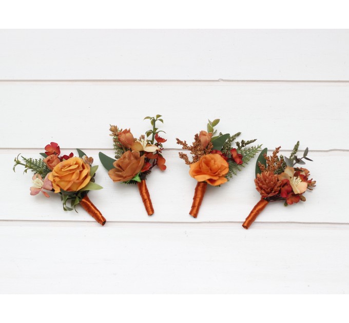 Wedding boutonnieres and wrist corsage in rust orange color scheme. Flower accessories. 5213