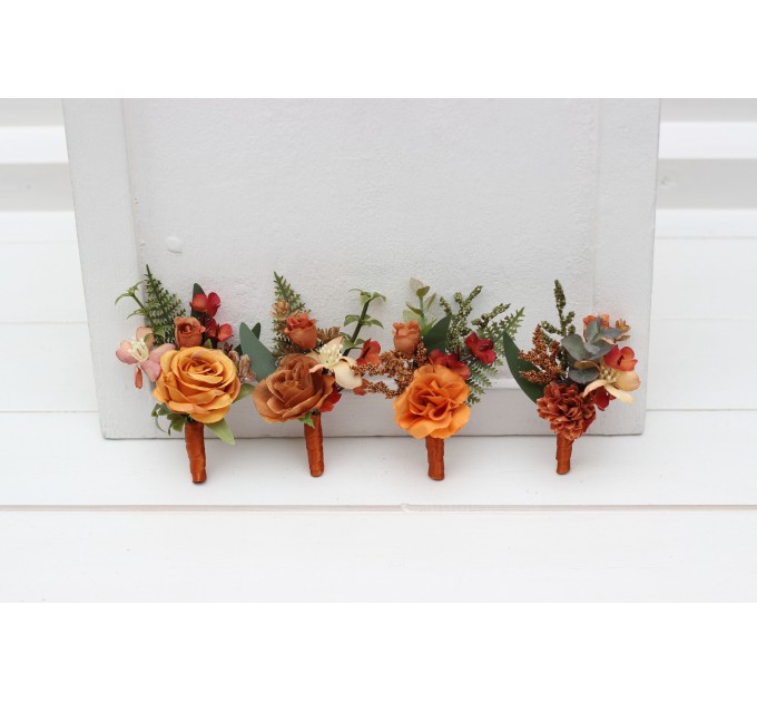 Wedding boutonnieres and wrist corsage in rust orange color scheme. Flower accessories. 5213