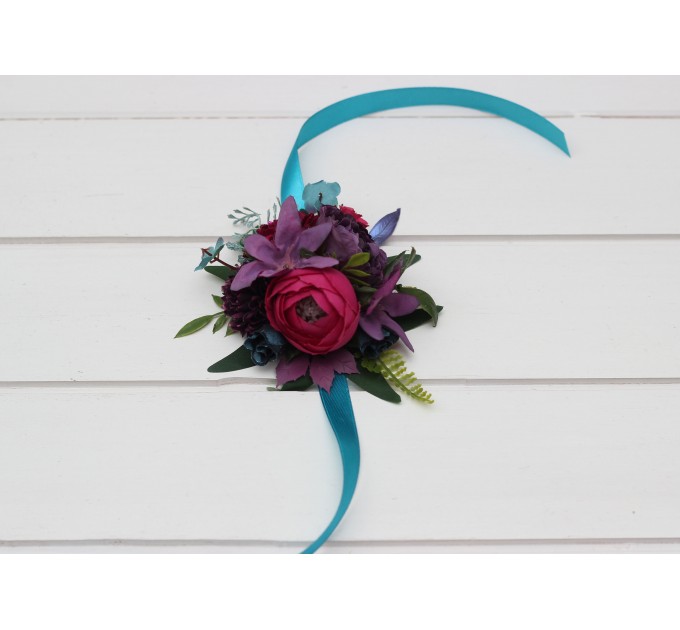 Wedding boutonnieres and wrist corsage in teal magenta blue and purple color scheme. Flower accessories. 5225