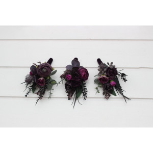 Wedding boutonnieres in a black, purple, and magenta colors. 5370