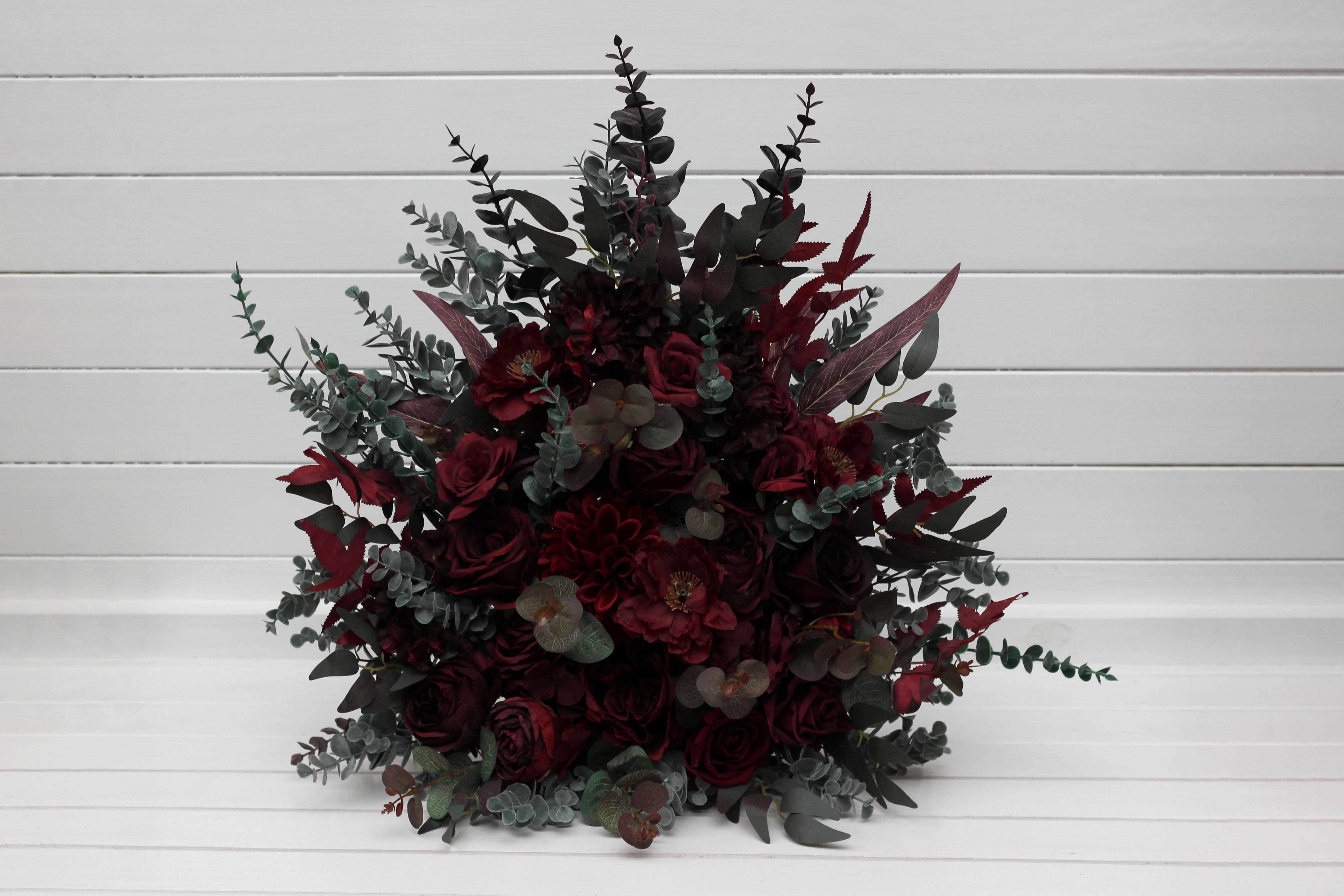 Moody dark burgundy wedding centerpiece flowers