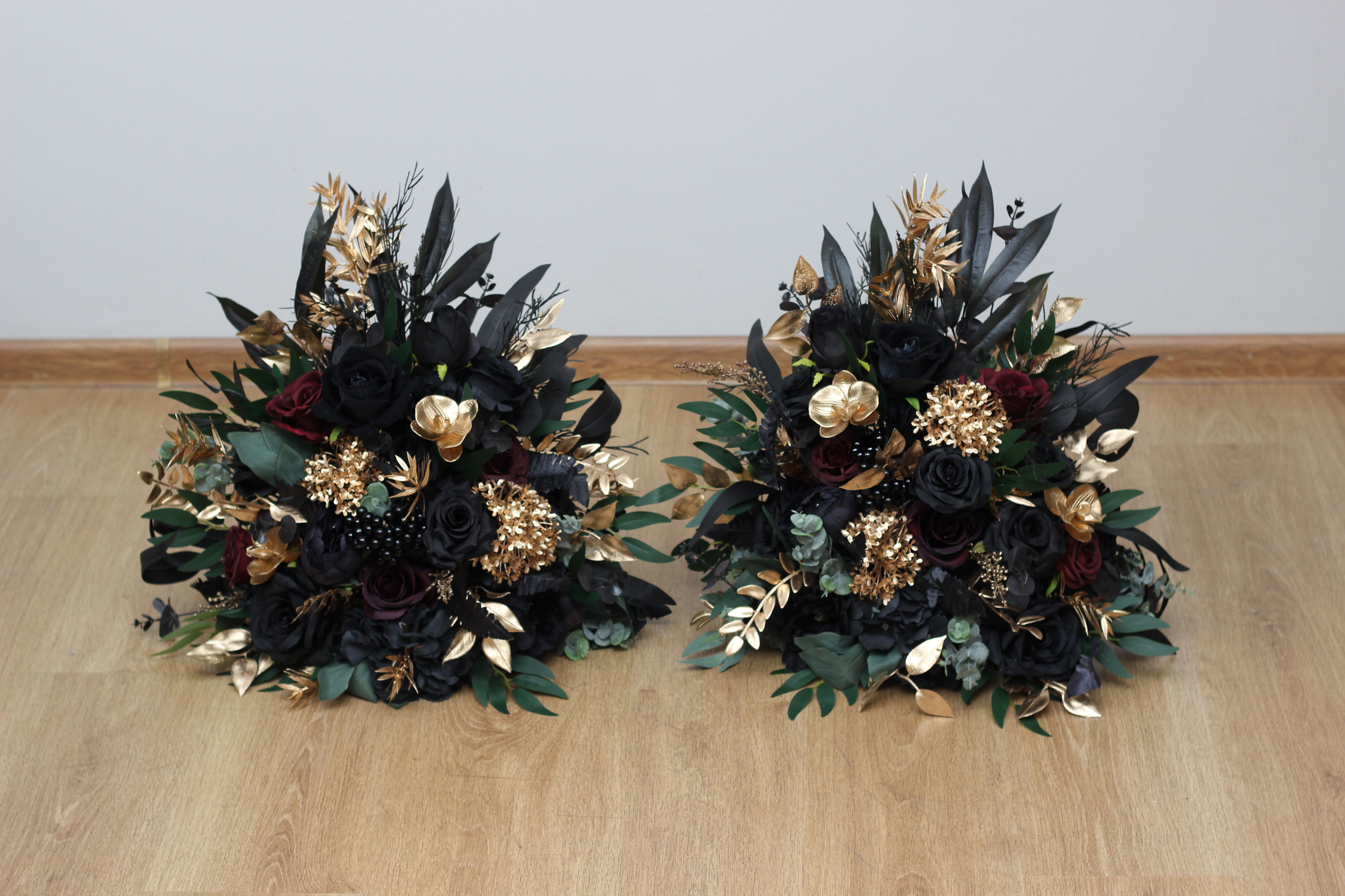Black burgundy and gold floral arrangement