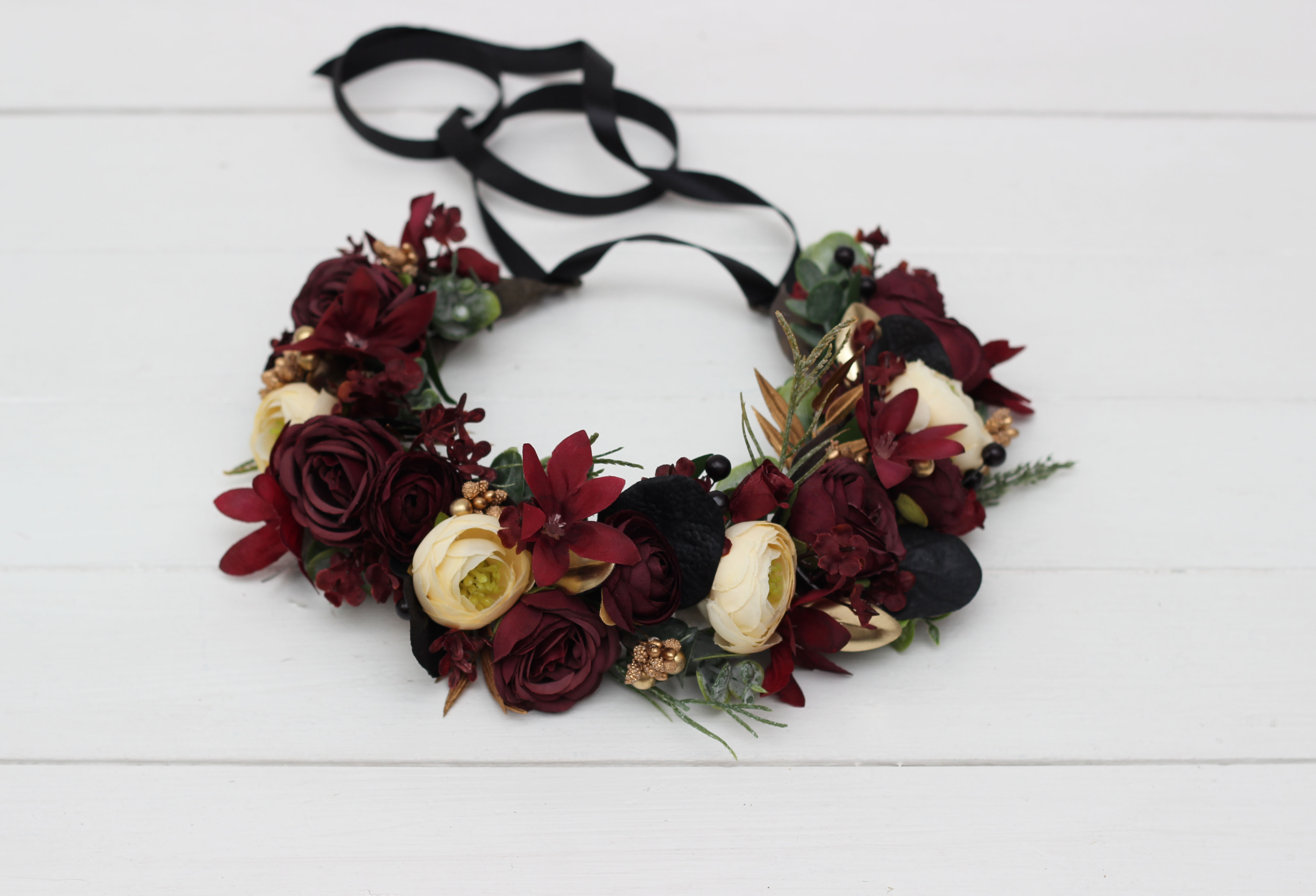 Burgundy black gold and ivory floral arrangement
