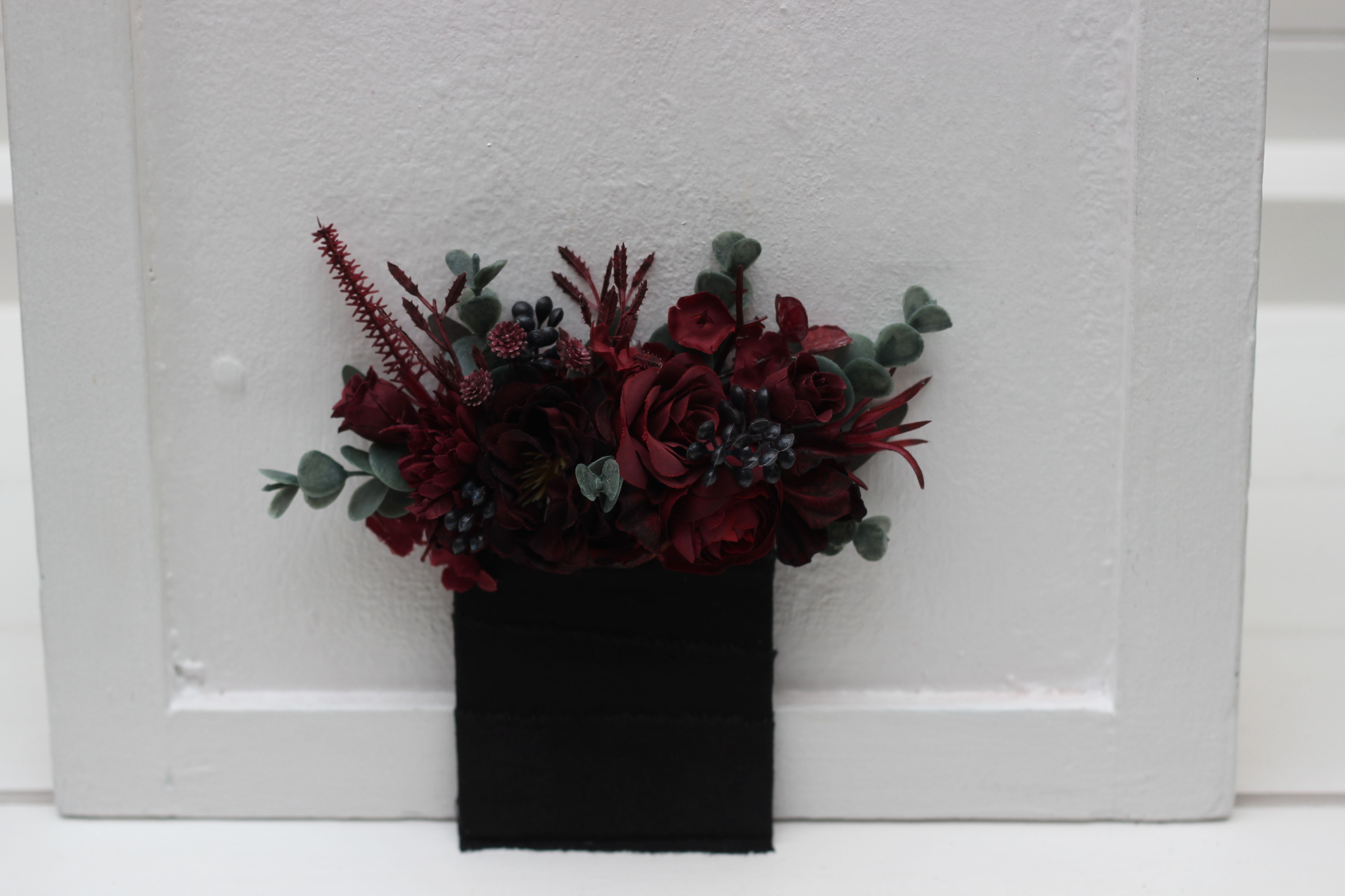 Moody dark burgundy pocket boutonniere