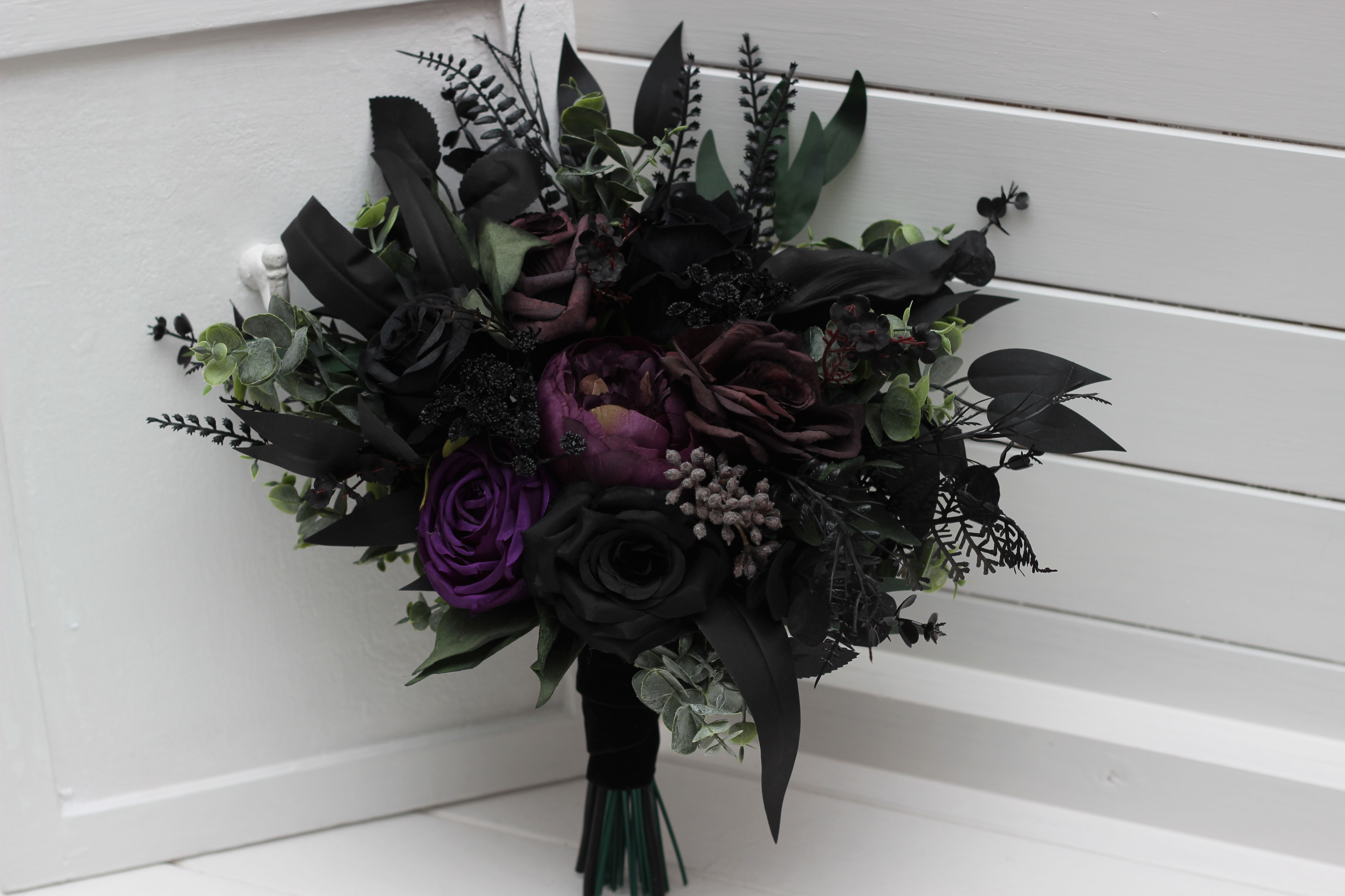 Deep purple royal purple black and green bridal bouquet