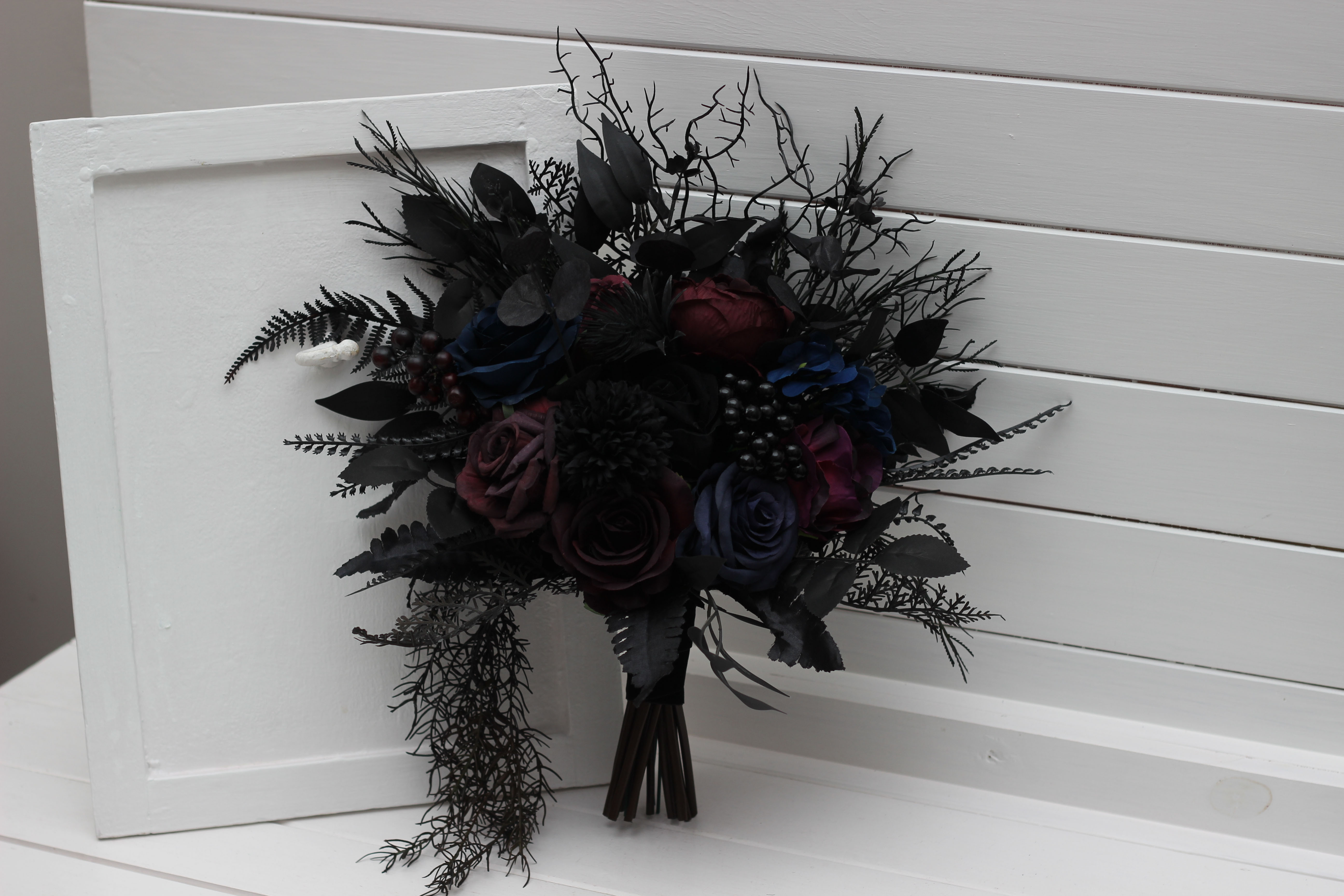 Burgundy black blue and purple boutonniere