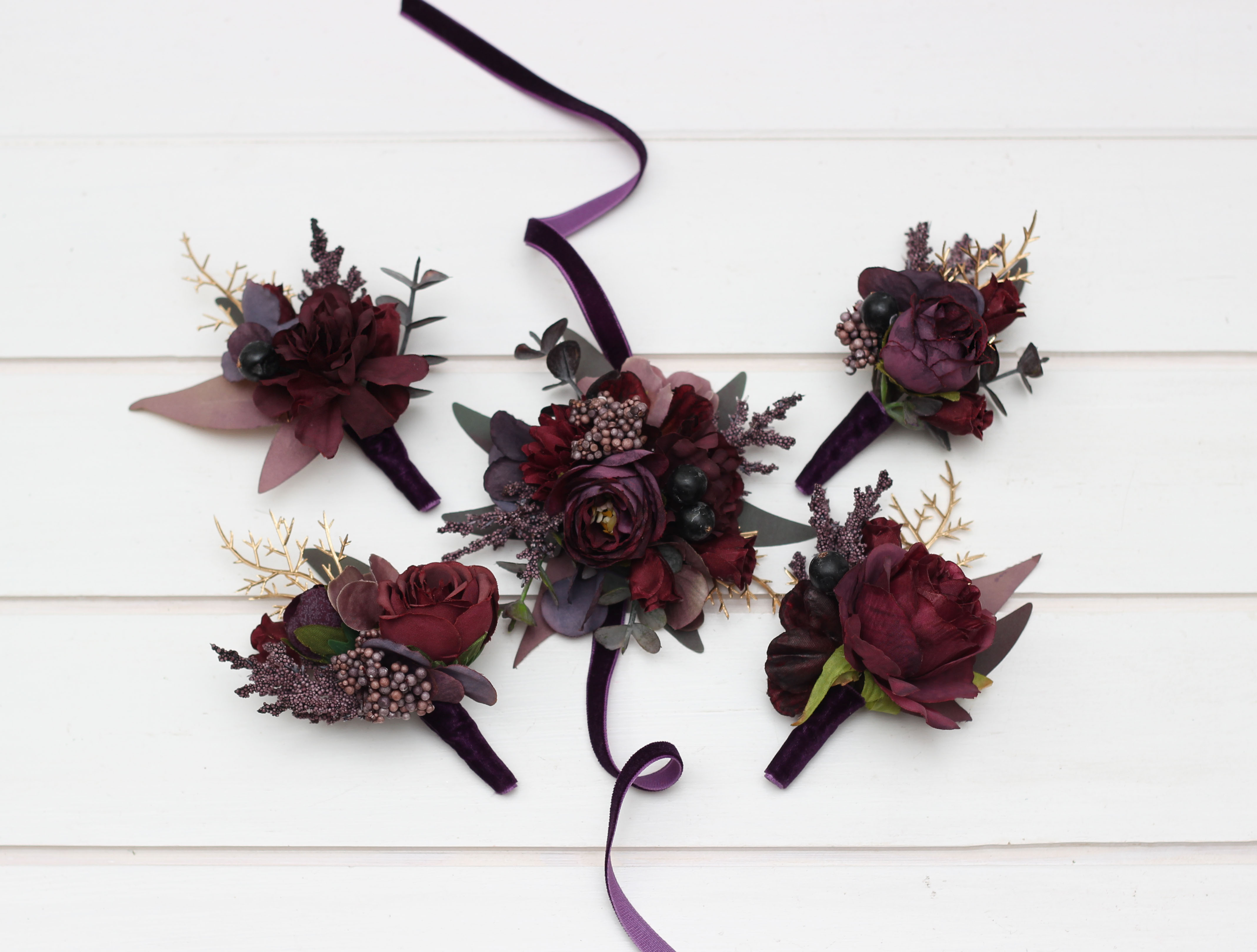 Deep purple burgundy and gold boutonniere