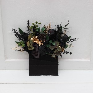 Pocket boutonniere in black gold green color scheme. 5333